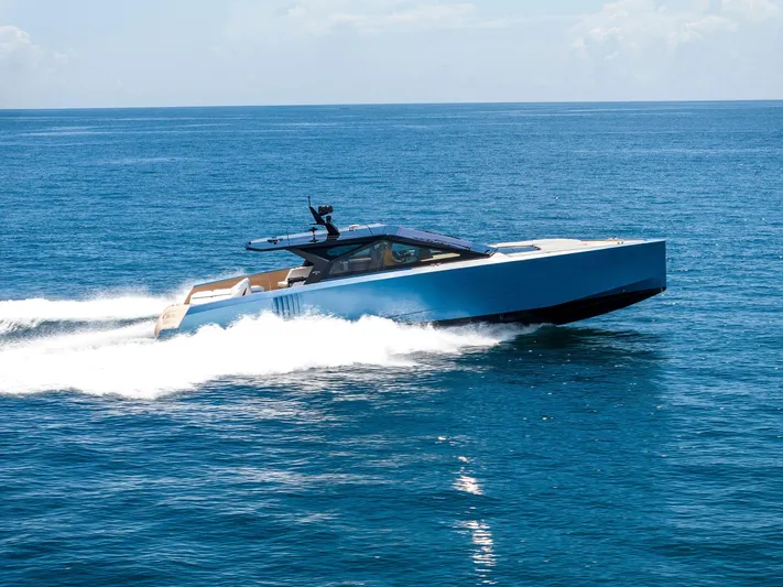  Yacht Photos Pics 2023 Wally WALLYPOWER58 yacht cruising on open sea, showcasing sleek design and speed.
