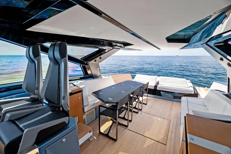  Yacht Photos Pics Luxurious 2023 Wally WALLYPOWER58 yacht interior with sleek seating and ocean view.