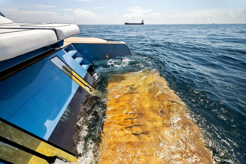  Yacht Photos Pics 2023 Wally WALLYPOWER58 yacht cruising on open sea with distant ship.