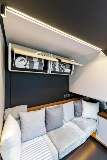  Yacht Photos Pics Luxurious interior of 2023 Wally WALLYPOWER58 yacht with modern seating and storage.