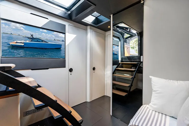  Yacht Photos Pics Luxurious interior of 2023 Wally WALLYPOWER58 yacht with modern design and staircase.