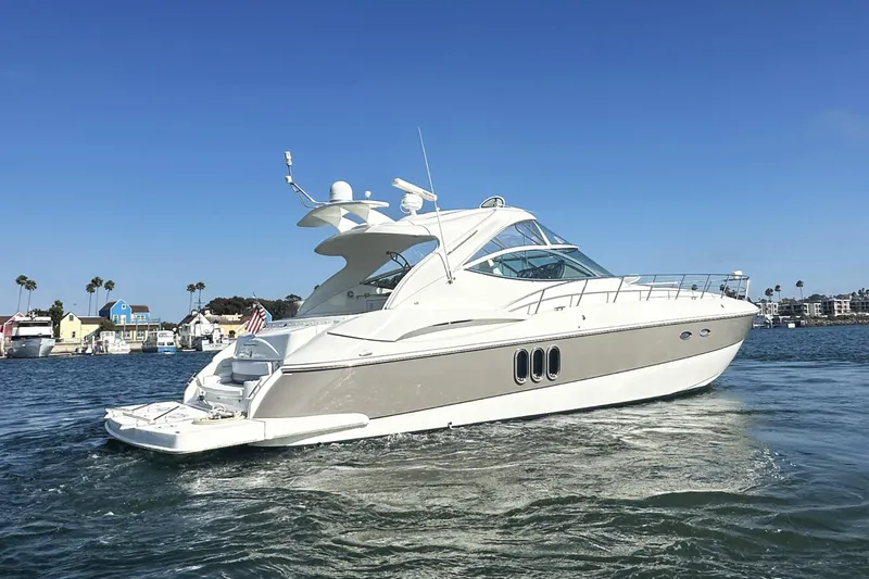  Yacht Photos Pics 2007 Cruisers Yachts 540 Express on water, clear sky, coastal background.