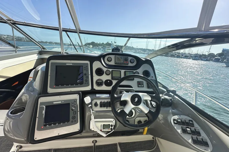  Yacht Photos Pics Cockpit of 2007 Cruisers Yachts 540 Express with navigation equipment and steering wheel.