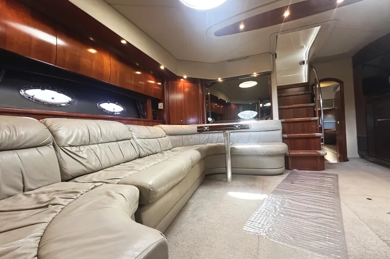  Yacht Photos Pics Luxurious interior of 2007 Cruisers Yachts 540 Express with leather seating and wooden accents.