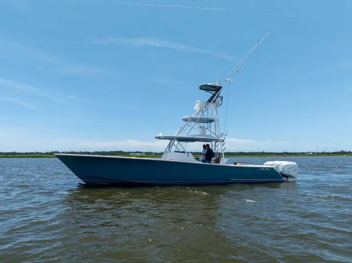 Patriot Yacht Photos Pics 2022 Valhalla Boatworks V41 on calm water under clear blue sky.