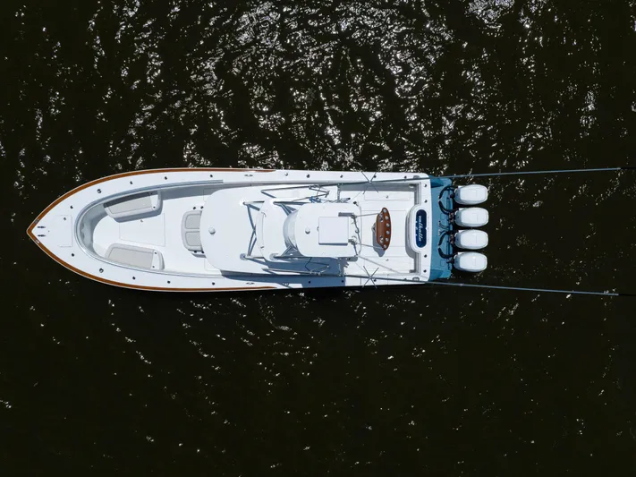 Patriot Yacht Photos Pics Overhead view of 2022 Valhalla Boatworks V41 on water, showcasing sleek design and triple engines.
