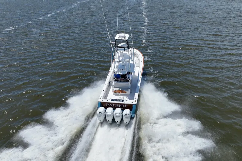 Patriot Yacht Photos Pics 2022 Valhalla Boatworks V41 speeding on open water, rear view.
