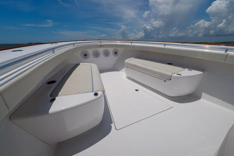 Patriot Yacht Photos Pics 2022 Valhalla Boatworks V41 interior with cushioned seating under a clear blue sky.