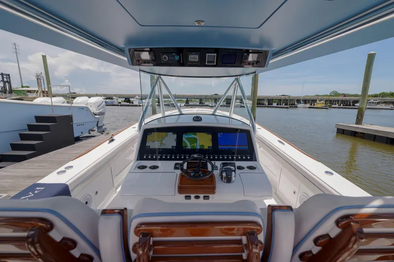 Patriot Yacht Photos Pics 2022 Valhalla Boatworks V41 helm with advanced navigation system, docked at marina.