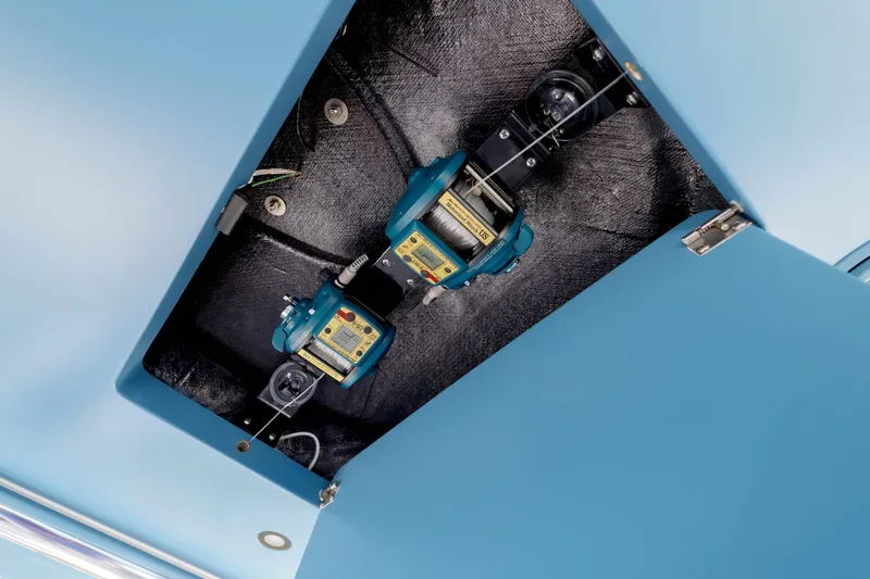 Patriot Yacht Photos Pics 2022 Valhalla Boatworks V41 equipment compartment with blue interior and mechanical components.