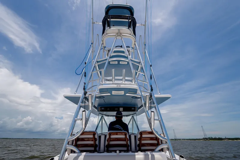 Patriot Yacht Photos Pics 2022 Valhalla Boatworks V41 on water, viewed from rear, under a clear sky.