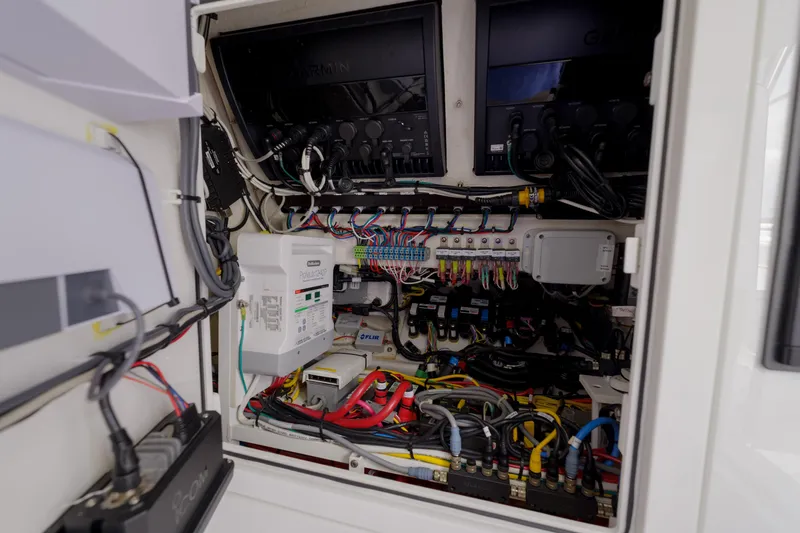 Patriot Yacht Photos Pics Electrical system inside 2022 Valhalla Boatworks V41, featuring organized wiring and Garmin equipment.
