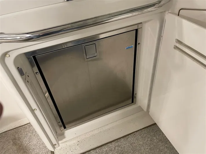 Lightning Strike Yacht Photos Pics Built-in stainless steel refrigerator on 2009 Sea Ray 43 Sundancer yacht.