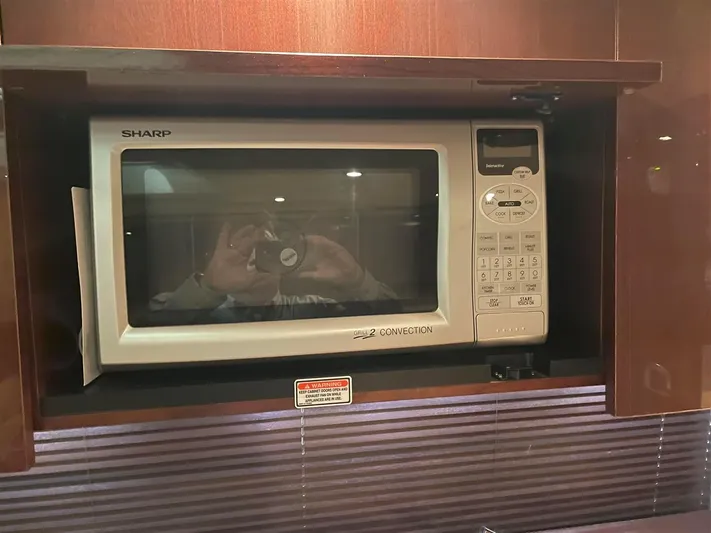 Lightning Strike Yacht Photos Pics Built-in Sharp microwave in 2009 Sea Ray 43 Sundancer yacht kitchen.