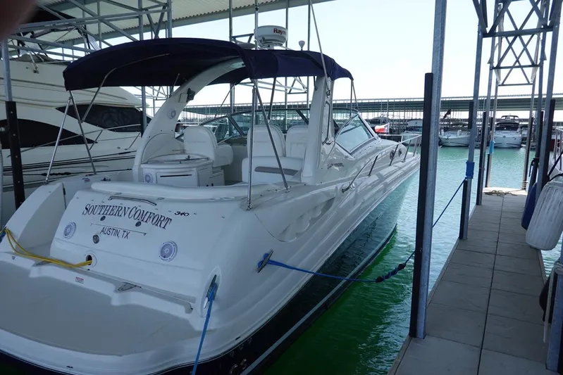  Yacht Photos Pics 2005 Sea Ray 340 Sundancer docked in marina, featuring sleek design and canopy.