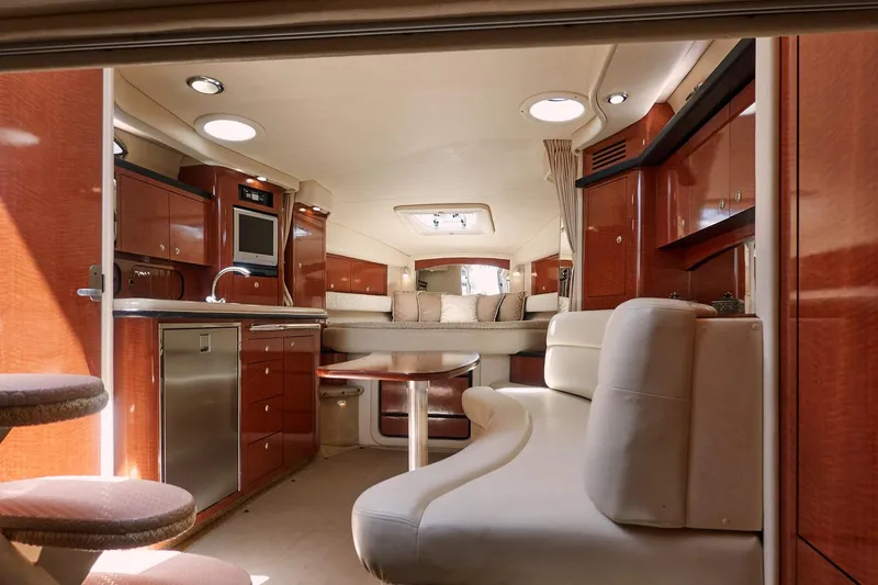  Yacht Photos Pics Luxurious interior of a 2005 Sea Ray 340 Sundancer yacht with elegant wood finishes.