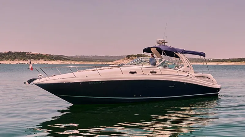  Yacht Photos Pics 2005 Sea Ray 340 Sundancer boat on calm water with scenic background.