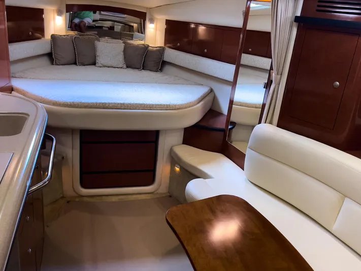  Yacht Photos Pics Interior of 2005 Sea Ray 340 Sundancer yacht with cozy seating and elegant wood finishes.