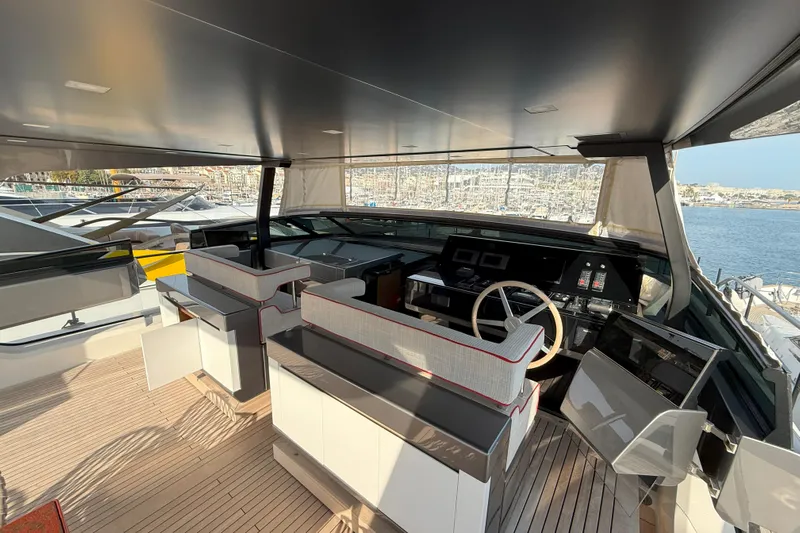 T-b Yacht Photos Pics Luxurious 2022 Sanlorenzo SL96A yacht helm with modern controls and panoramic marina view.