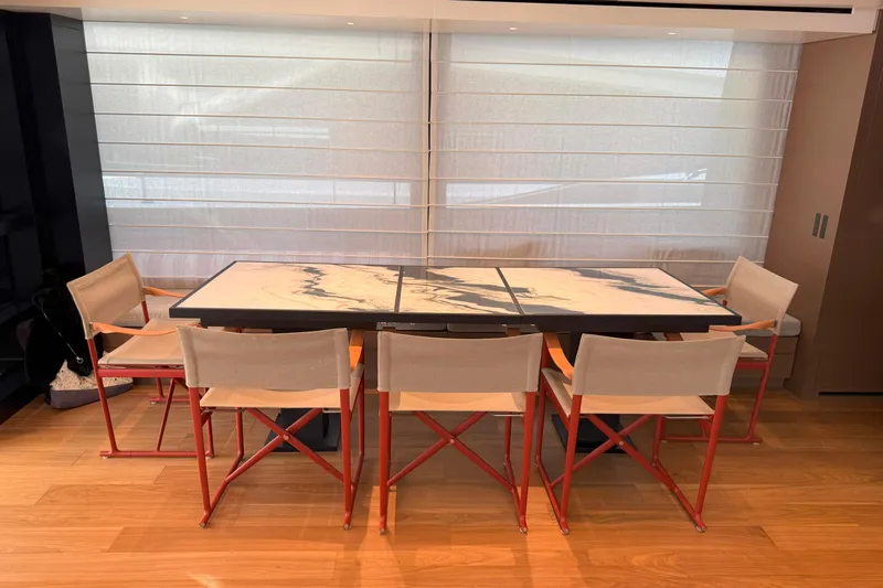 T-b Yacht Photos Pics Modern dining area on 2022 Sanlorenzo SL96A yacht with stylish table and chairs.