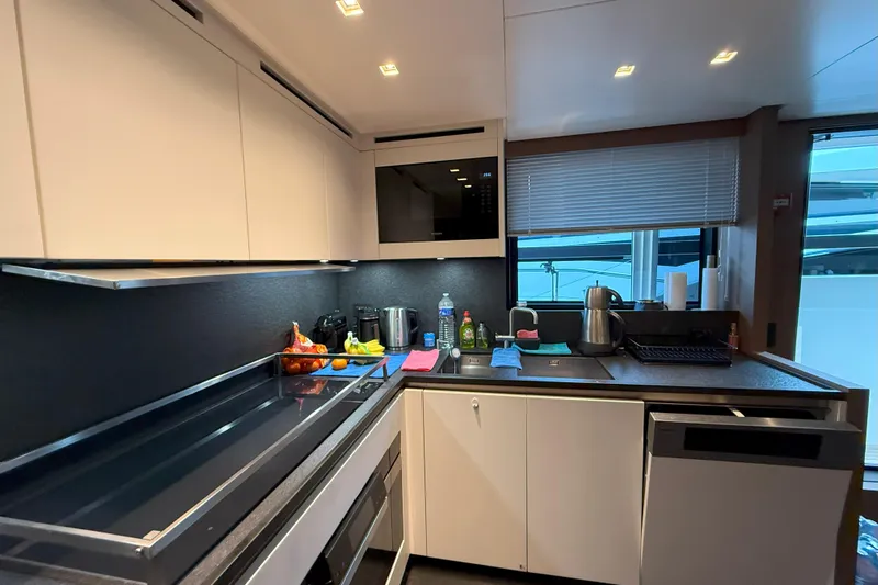 T-b Yacht Photos Pics Modern kitchen interior on 2022 Sanlorenzo SL96A yacht, featuring sleek appliances and ample counter space.