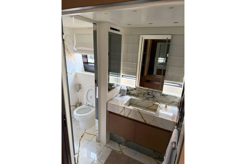 T-b Yacht Photos Pics Luxurious bathroom in 2022 Sanlorenzo SL96A yacht with marble finishes and modern fixtures.