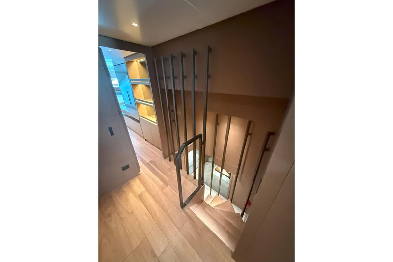 T-b Yacht Photos Pics Elegant interior staircase of 2022 Sanlorenzo SL96A yacht with modern design and wooden flooring.
