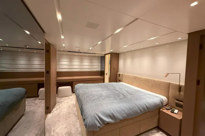 T-b Yacht Photos Pics Luxurious bedroom interior of 2022 Sanlorenzo SL96A yacht with modern design and ambient lighting.