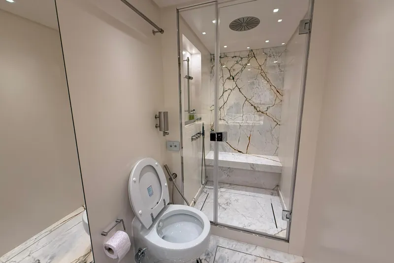 T-b Yacht Photos Pics Luxurious bathroom on 2022 Sanlorenzo SL96A yacht with marble shower and modern fixtures.
