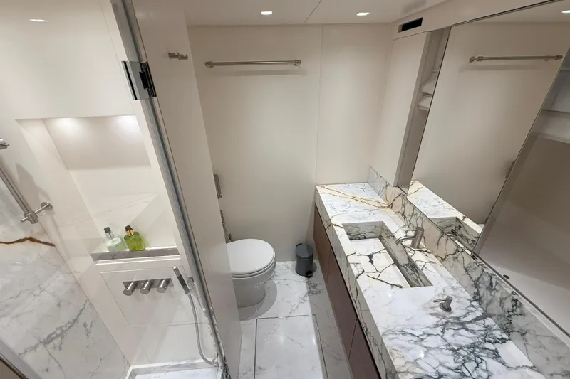T-b Yacht Photos Pics Luxurious marble bathroom in 2022 Sanlorenzo SL96A yacht, featuring modern fixtures and elegant design.