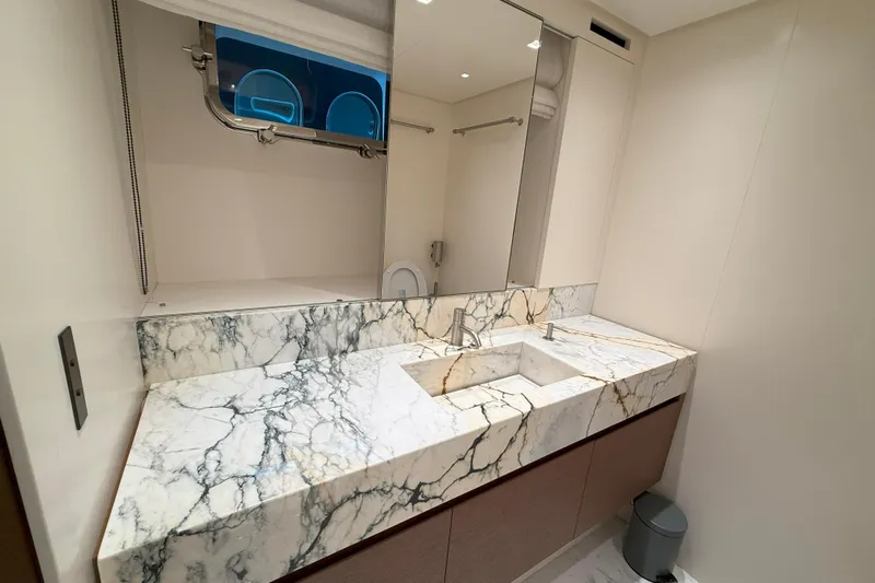 T-b Yacht Photos Pics Luxurious marble bathroom in 2022 Sanlorenzo SL96A yacht, featuring modern fixtures and elegant design.