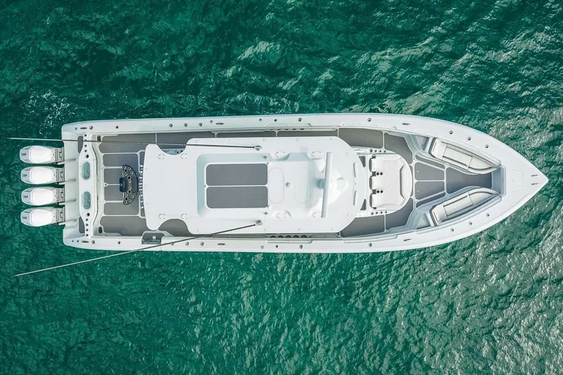  Yacht Photos Pics Aerial view of 2024 Yellowfin 54 Offshore boat on turquoise water.