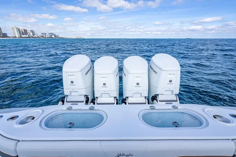 Yacht Photos Pics 2024 Yellowfin 54 Offshore boat with four Mercury engines on open sea.