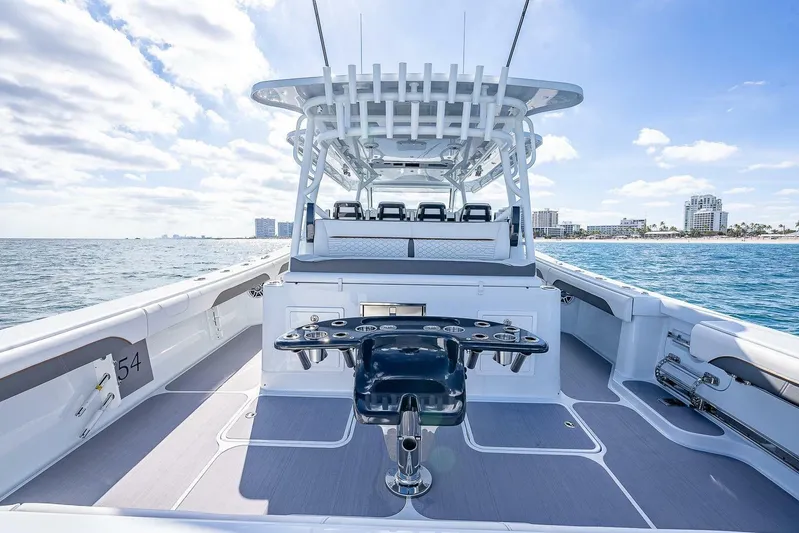  Yacht Photos Pics 2024 Yellowfin 54 Offshore boat interior with ocean view and city skyline.