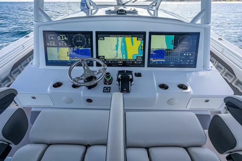  Yacht Photos Pics 2024 Yellowfin 54 Offshore helm with advanced navigation displays and controls.