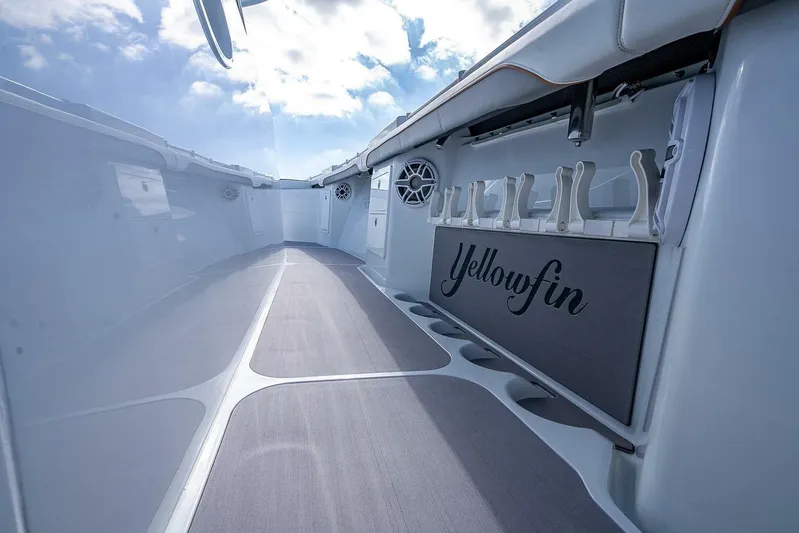 Yacht Photos Pics 2024 Yellowfin 54 Offshore boat interior with rod holders and sleek design.