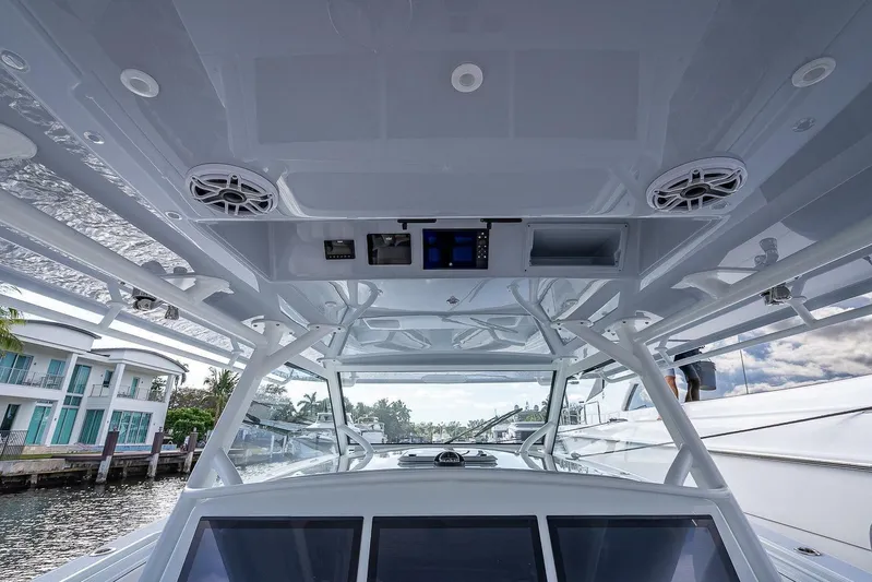  Yacht Photos Pics 2024 Yellowfin 54 Offshore boat interior with modern electronics and sleek design.