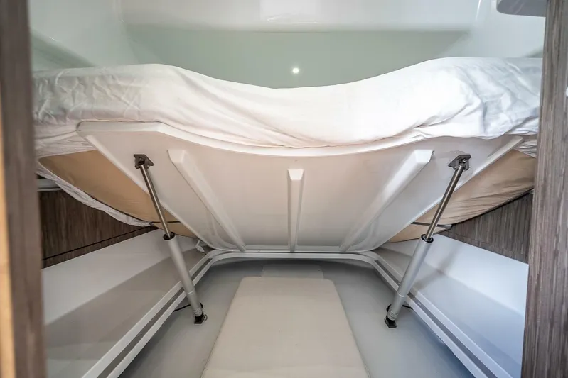  Yacht Photos Pics 2024 Yellowfin 54 Offshore boat interior with under-bed storage compartment.