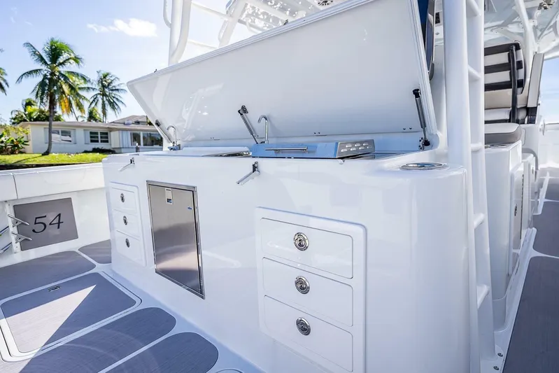 Yacht Photos Pics 2024 Yellowfin 54 Offshore boat interior with storage compartments and sleek design.