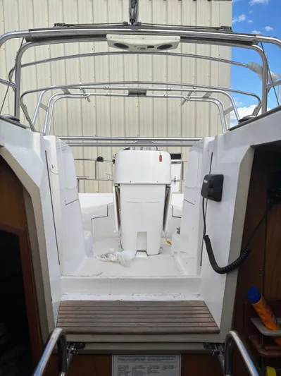 Royal Dawn Yacht Photos Pics Interior view of a 2001 Hunter 460 sailboat cockpit with steering wheel and equipment.