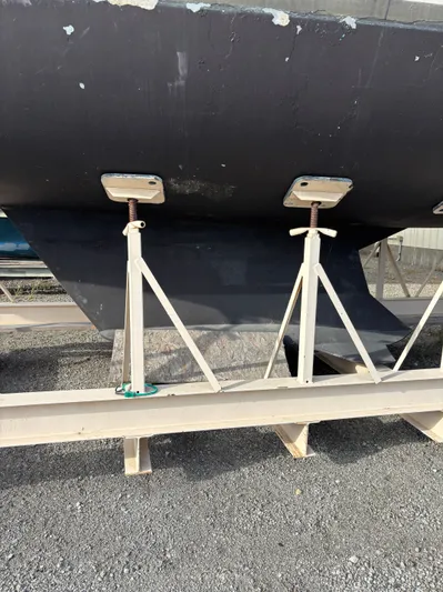 Royal Dawn Yacht Photos Pics Bottom view of a 2001 Hunter 460 sailboat hull supported by stands.