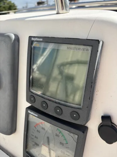 Royal Dawn Yacht Photos Pics Raytheon Masterview display on 2001 Hunter 460 yacht dashboard, showing navigation instruments.