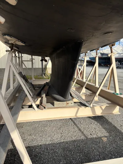 Royal Dawn Yacht Photos Pics Underneath view of a 2001 Hunter 460 sailboat keel on a support frame.