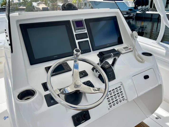  Yacht Photos Pics 2013 Intrepid 375 Center Console helm with dual screens and steering wheel.