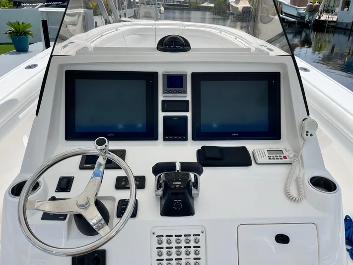  Yacht Photos Pics 2013 Intrepid 375 Center Console helm with dual screens and steering wheel.