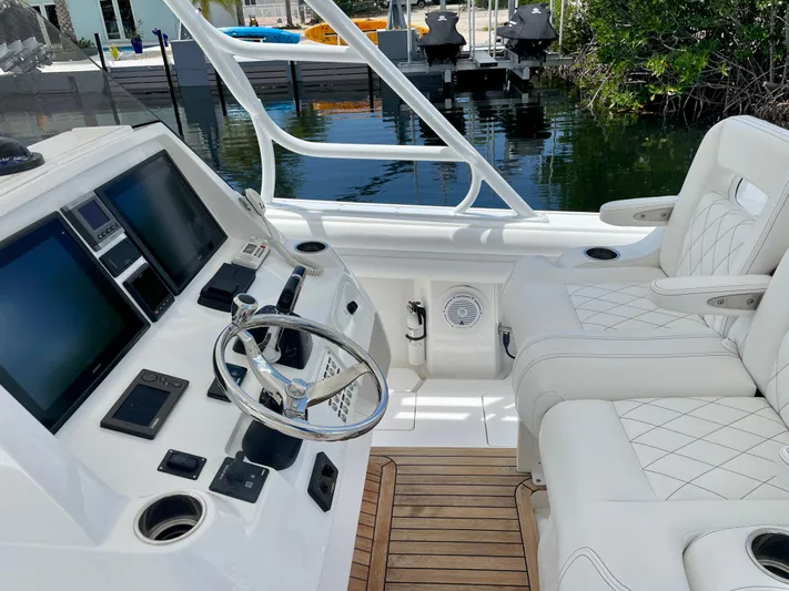  Yacht Photos Pics 2013 Intrepid 375 Center Console boat interior with steering wheel and dual screens.