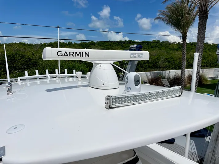  Yacht Photos Pics Garmin radar on 2013 Intrepid 375 Center Console boat under blue sky.