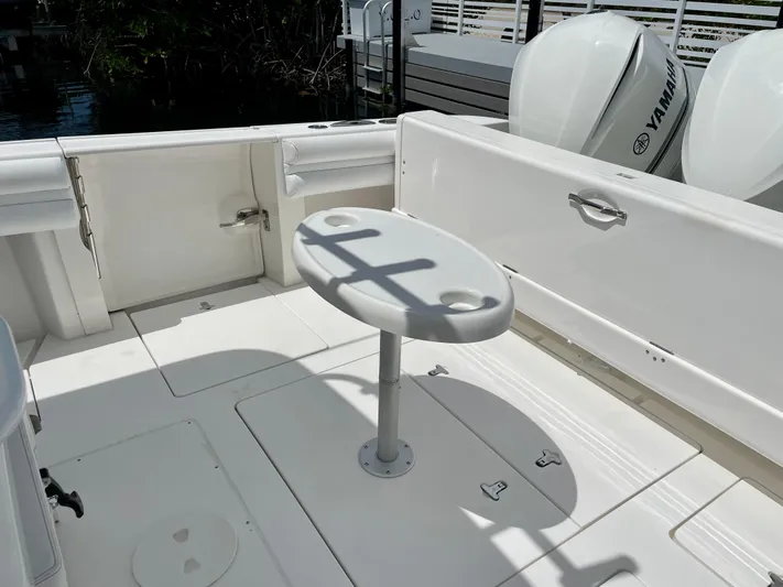  Yacht Photos Pics 2013 Intrepid 375 Center Console boat deck with table and Yamaha engines.