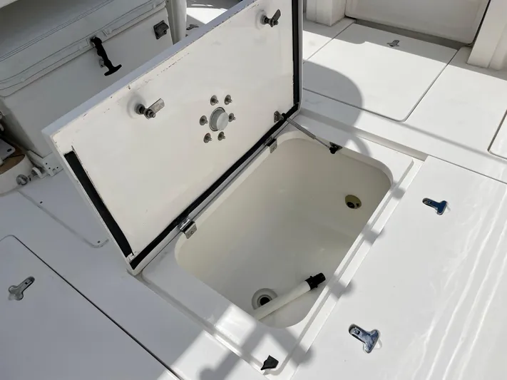  Yacht Photos Pics Open storage compartment on 2013 Intrepid 375 Center Console boat deck.