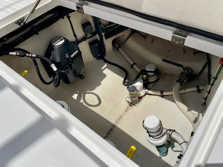  Yacht Photos Pics 2013 Intrepid 375 Center Console engine compartment with visible hoses and components.